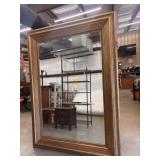 Vintage oversized floor mirror features a wide,