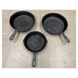 Vintage black cast-iron skillets.