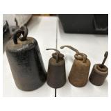Vintage  cast-iron hanging scale weights.
