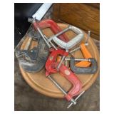 Assortment of 7 metal C-clamps.
