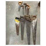 Bundle vintage wooden-handled crosscut hand saws.
