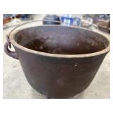 Antique cast iron pot or small cauldron.