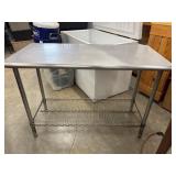 Commercial-grade stainless steel top work table.