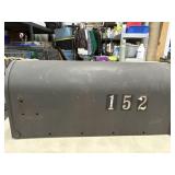 Metal curbside mailbox.