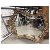 Vintage Rococo-style gold gilt wall mirror.