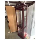 Traditional-style curio display cabinet featuring