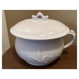Vintage white ironstone chamber pot with an