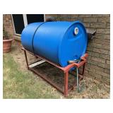 55 gallon rain water barrel on red iron stand