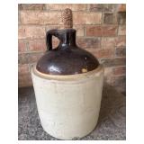 Antique two-tone stoneware whiskey jug.