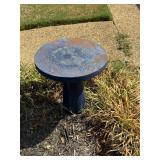 Round blue concrete yard pedestal.