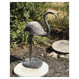 Garden sculpture of a crane or heron, mounted on