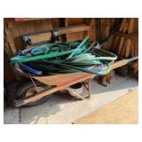 Wheelbarrow Full of Water Hoses, Garden Pots, and