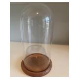 Glass display dome cloche features a classic