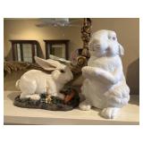Decorative glazed ceramic white rabbit figurines.