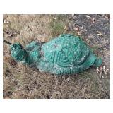 Concrete broke and chipped turtle.