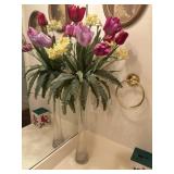 Tall, slender glass cylinder vase filled with an