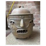 Large, anthropomorphic terracotta pottery vessel.