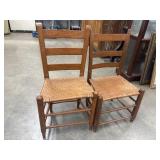 Pair of vintage wooden ladder-back chairs.