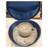 Vintage woven straw hat with a black ribbon band
