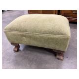 Light-green textured upholstered footstool