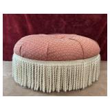 Round tufted upholstered ottoman