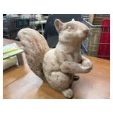Cast stone squirrel garden statue.