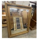 Large, ornate rectangular wall mirror with a