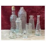 8 pc. vintage clear glass bottles and jars.