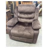 Brown overstuffed fabric manual recliner.