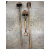 Old garden hoe and 2 shovels. Very weathered.