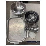 Stainless steel kitchen items, including a stack
