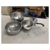 Silver-colored metal nesting mixing bowls, a