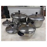 Vintage stainless steel pots and matching lids,