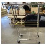 Double-sided chrome rolling garment rack.
