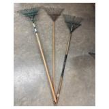 3 Traditional steel-tined lawn and leaf rakes.