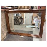 Rectangular wall mirror with a medium-brown