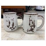 2 Vintage speckled stoneware coffee mugs.