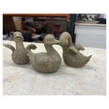 Set of three small, textured stone duck