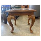 Traditional-style wooden end table.