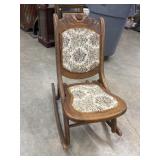Antique folding rocking chair.