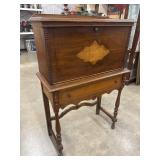 Antique drop-front walnut secretary desk.