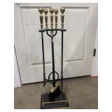 Classic five-piece fireplace tool set.