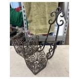 Set of decorative dark metal scroll baskets and a