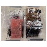 2 plastic bins contains various electronic and