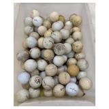 Large assortment of used, mixed-brand golf balls.