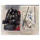 2 Plastic storage bins filled with electronic