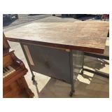 Vintage industrial workbench with a heavy wooden