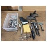 Collection of used hand tools, including several