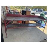 Heavy-duty industrial steel workbench with a