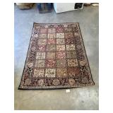 Traditional Persian-style panel garden rug.
